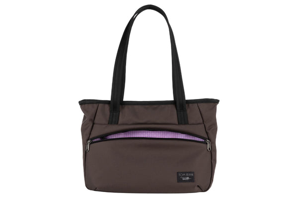 Photo of the Nomad Tote in Ursa Ballistic with Wisteria (pale purple with white grid) 200 Halcyon interior.